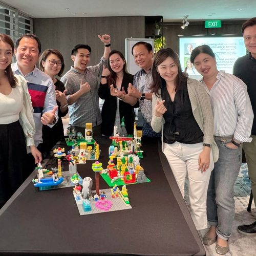 Team with their LEGO SERIOUS PLAY builds after a workshop